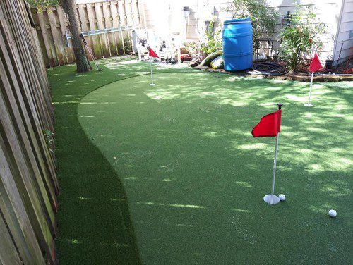 cool putting greens installation by Helms Landscape