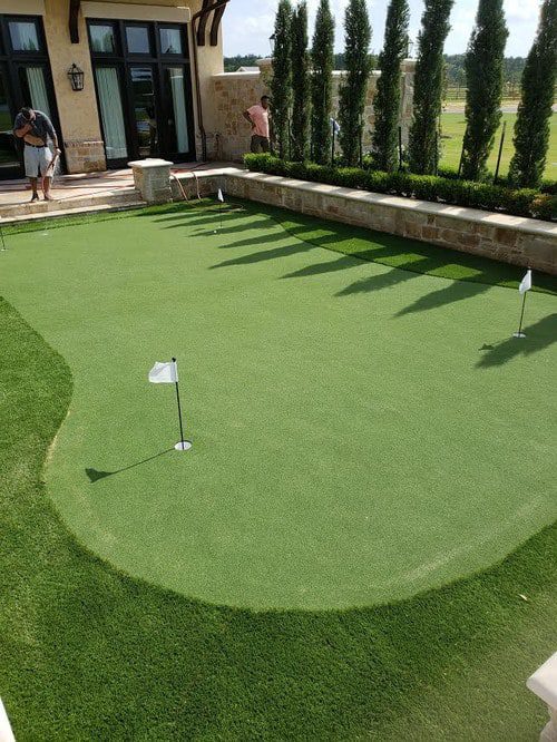 smooth putting greens installation by Helms Landscape