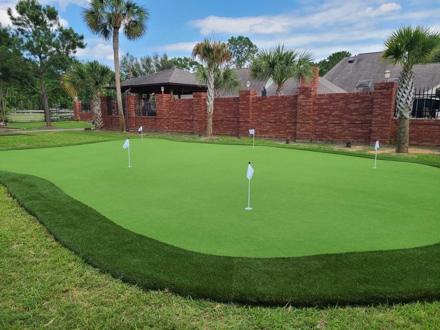 putting green installation grass landscaping work done in Houston, Texas residence